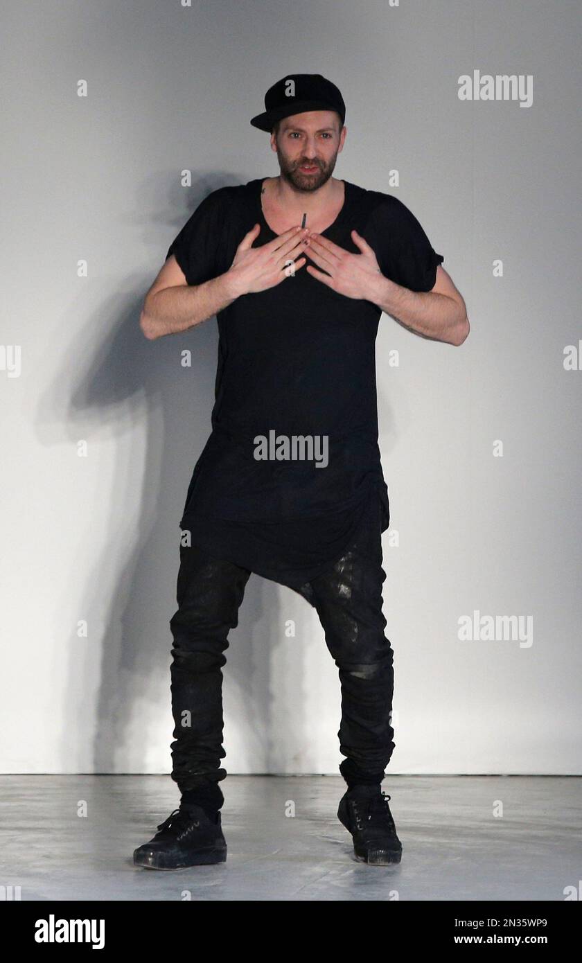 Designer Boris Bidjan Saberi acknowledges applause at the Designer Boris Bidjan Saberi acknowledges applause at the