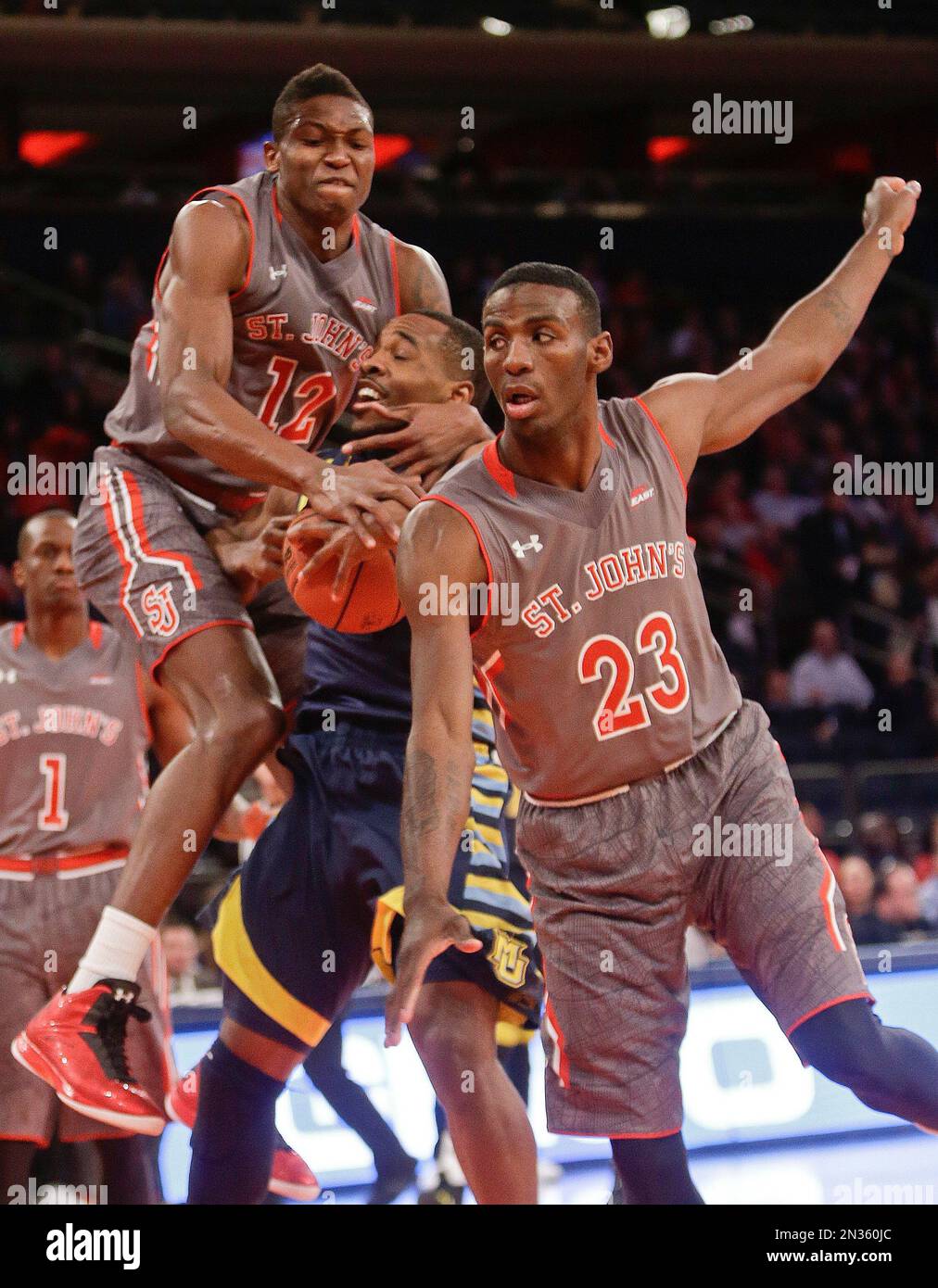 Rysheed Jordan St. John's's Chris Obekpa (12), of Nigeria, fouls Marquette's Derrick ...