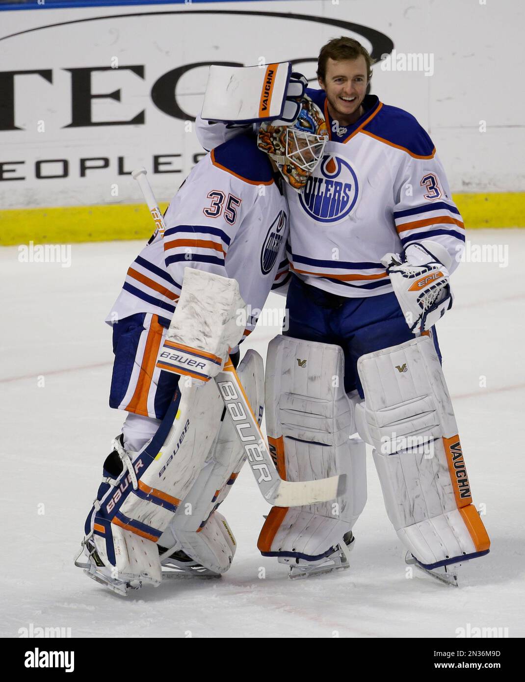 Starting Edmonton Oilers goalie Viktor Fasth (35) is hugged by goalie ...