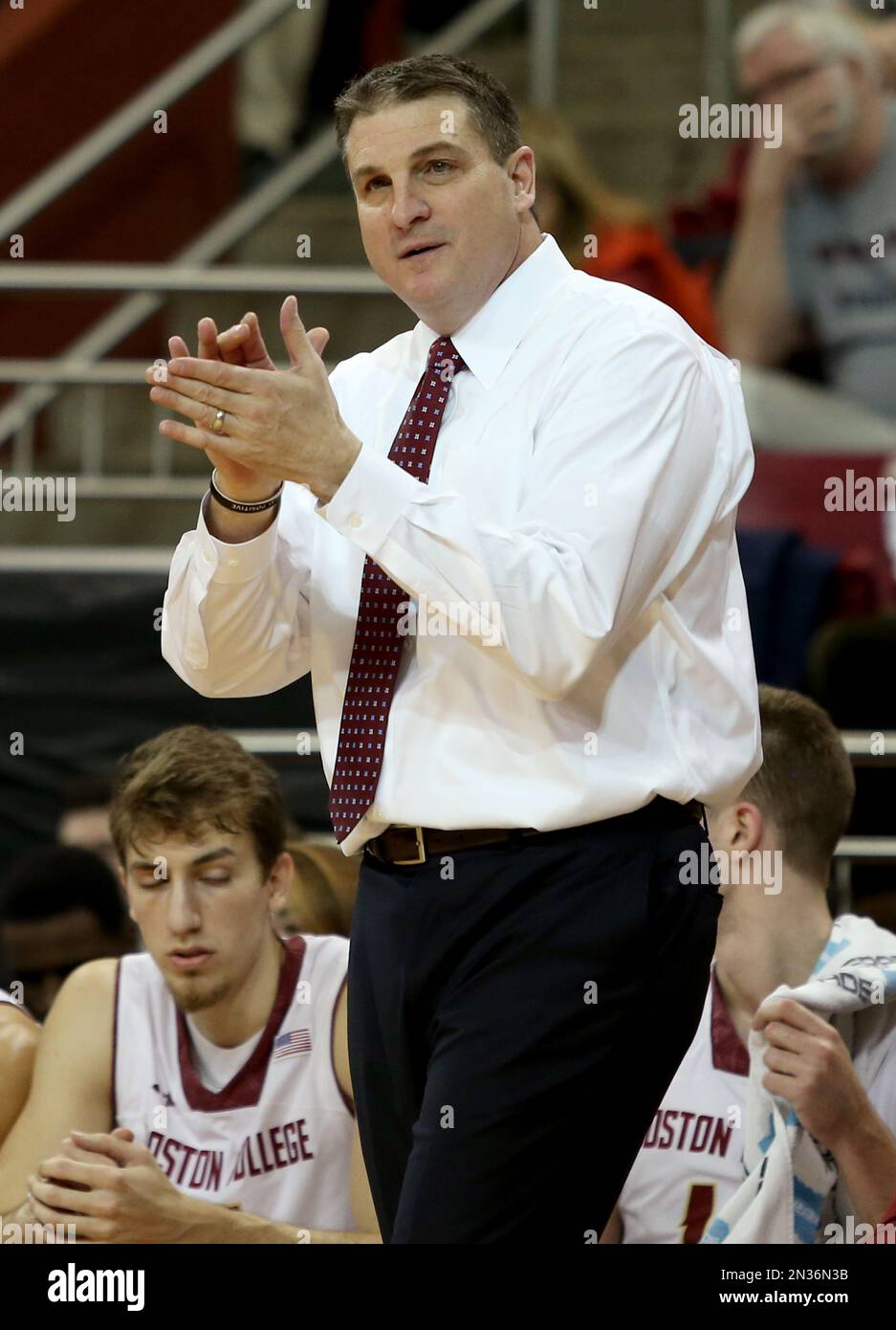 Boston College head coach Jim Christian encourages his team during the  first half of an NCAA college basketball game against Virginia, Saturday,  Jan. 17, 2015, in Boston. (AP Photo/Mary Schwalm Stock Photo -