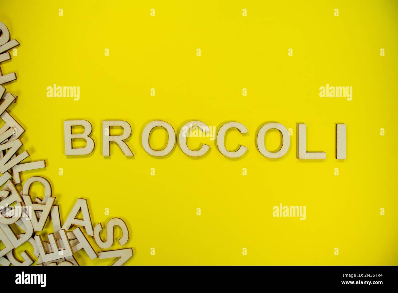 BROCCOLI in wooden English words language capital letters spilling from