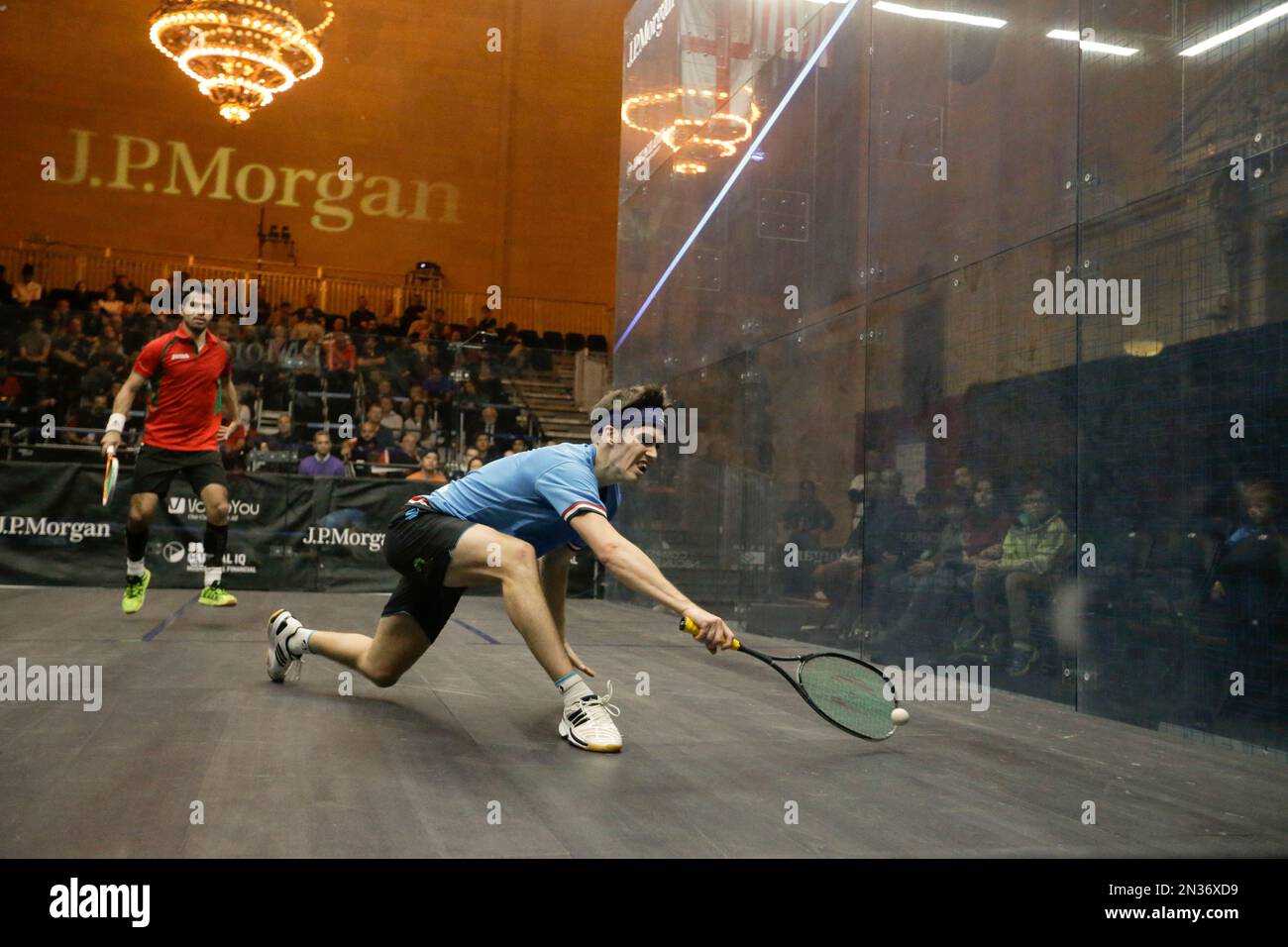 Fans watch as Britain's Chris Simpson, right, plays Cesar Salazar, of