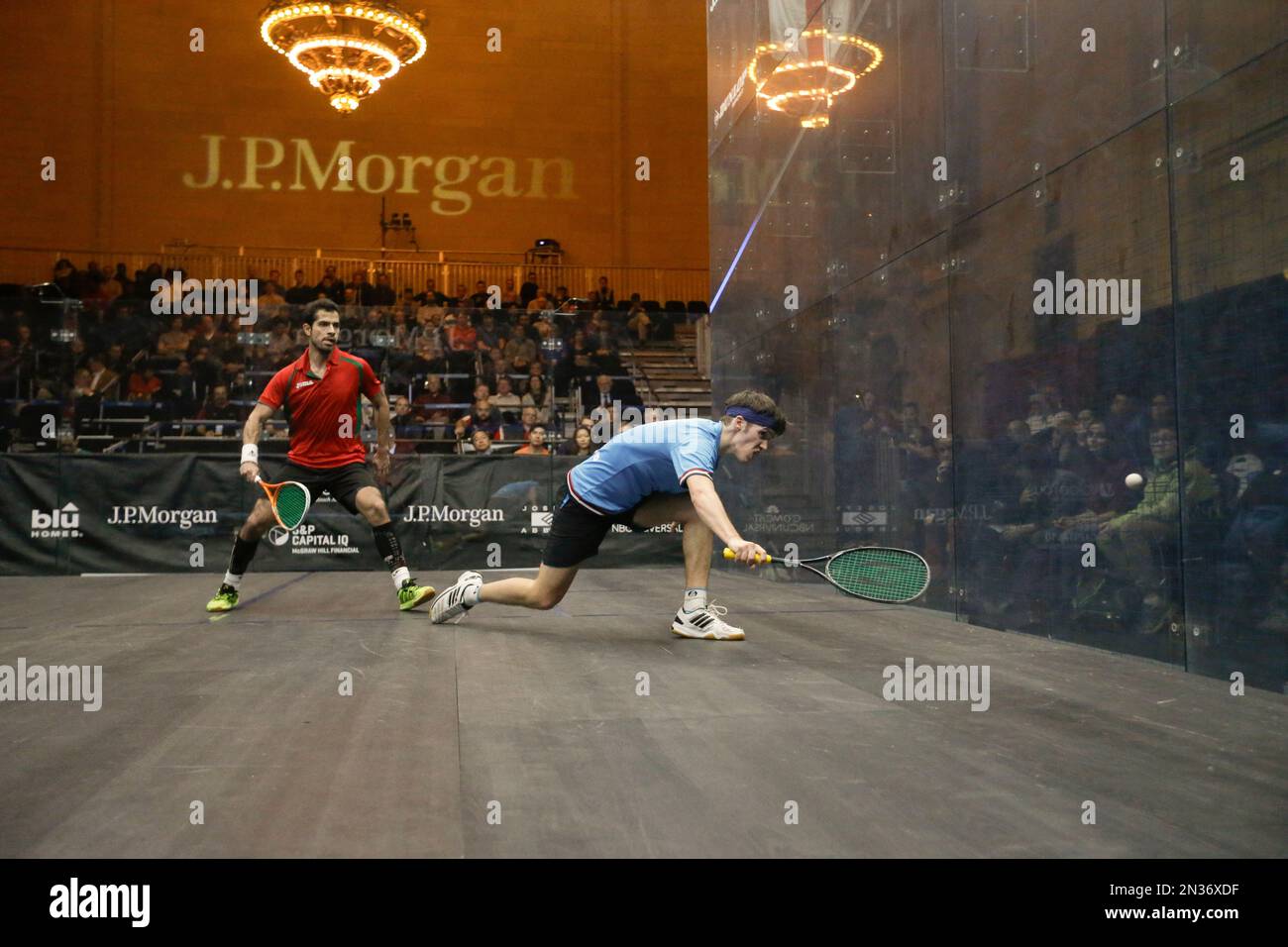 Fans watch as Britain's Chris Simpson, right, plays Cesar Salazar, of