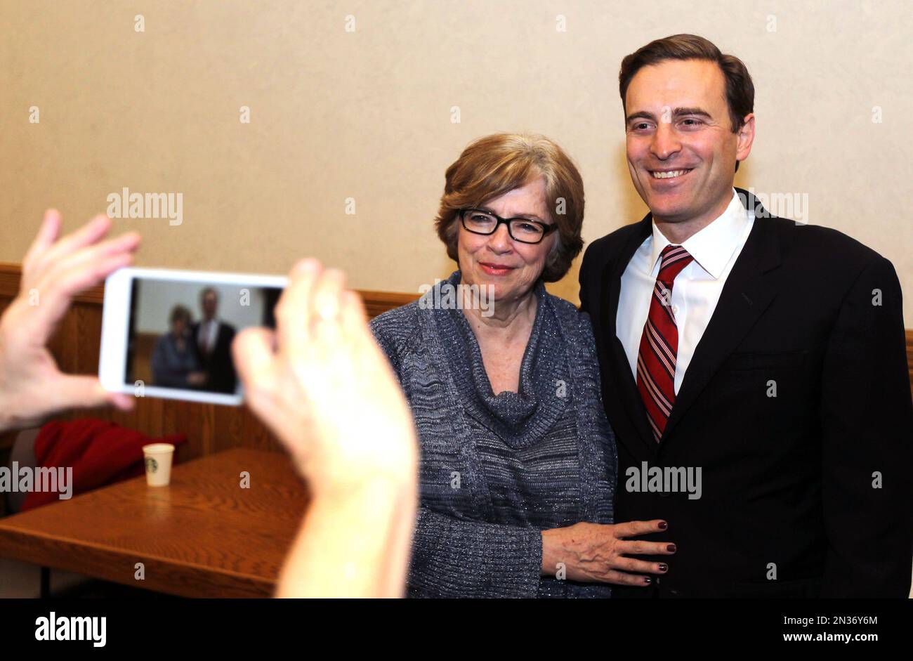 File In this Jan. 5, 2015, file photo, Nevada Attorney General Adam Paul Laxalt, right, poses