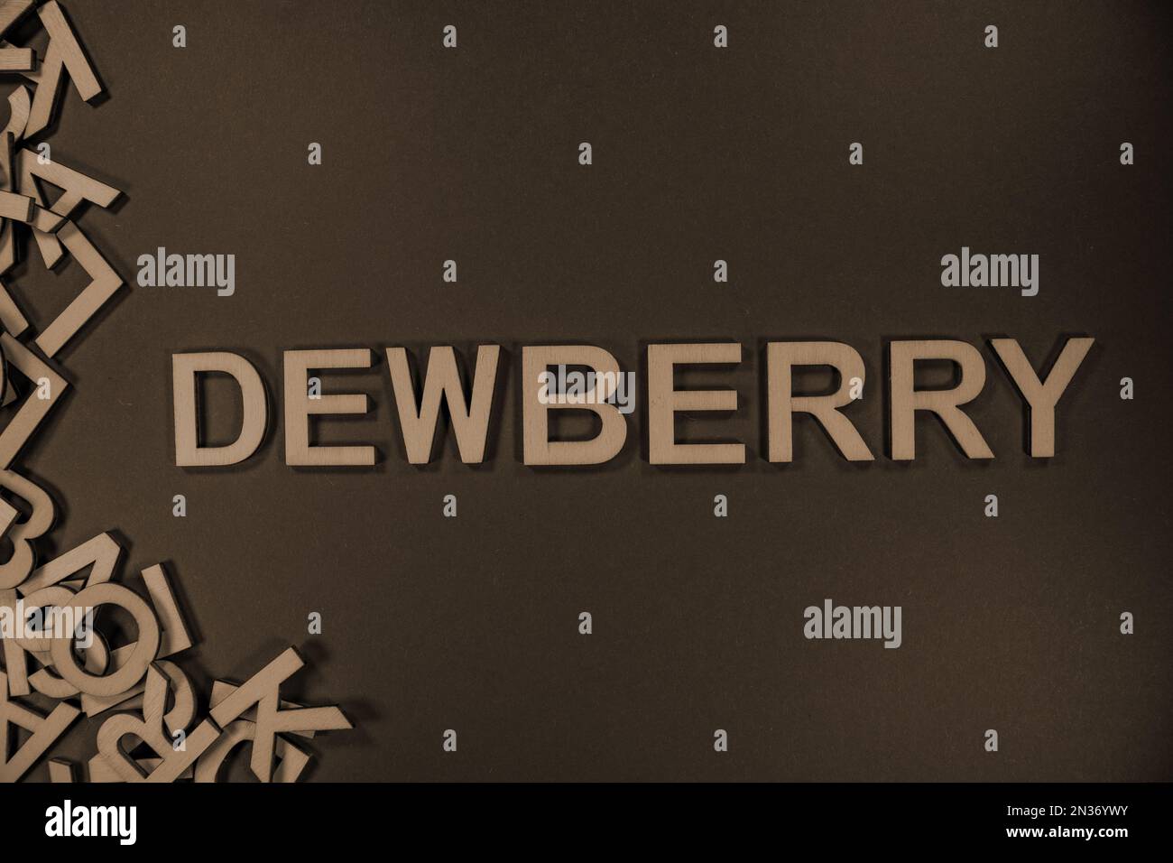 DEWBERRY in wooden English language capital letters spilling from a