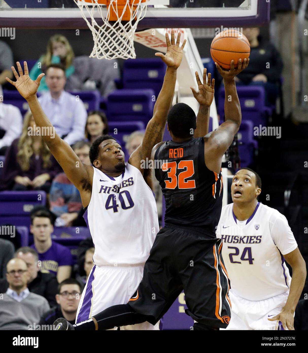 Washington's Shawn Kemp Jr. (40) and Robert Upshaw (24) defend as