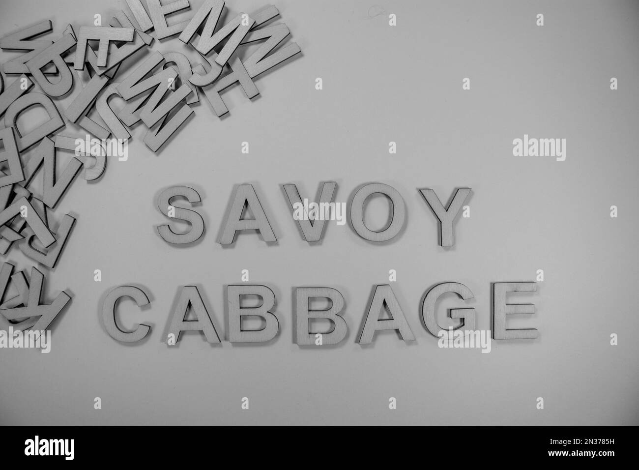 SAVOY CABBAGE in wooden English words language capital letters spilling