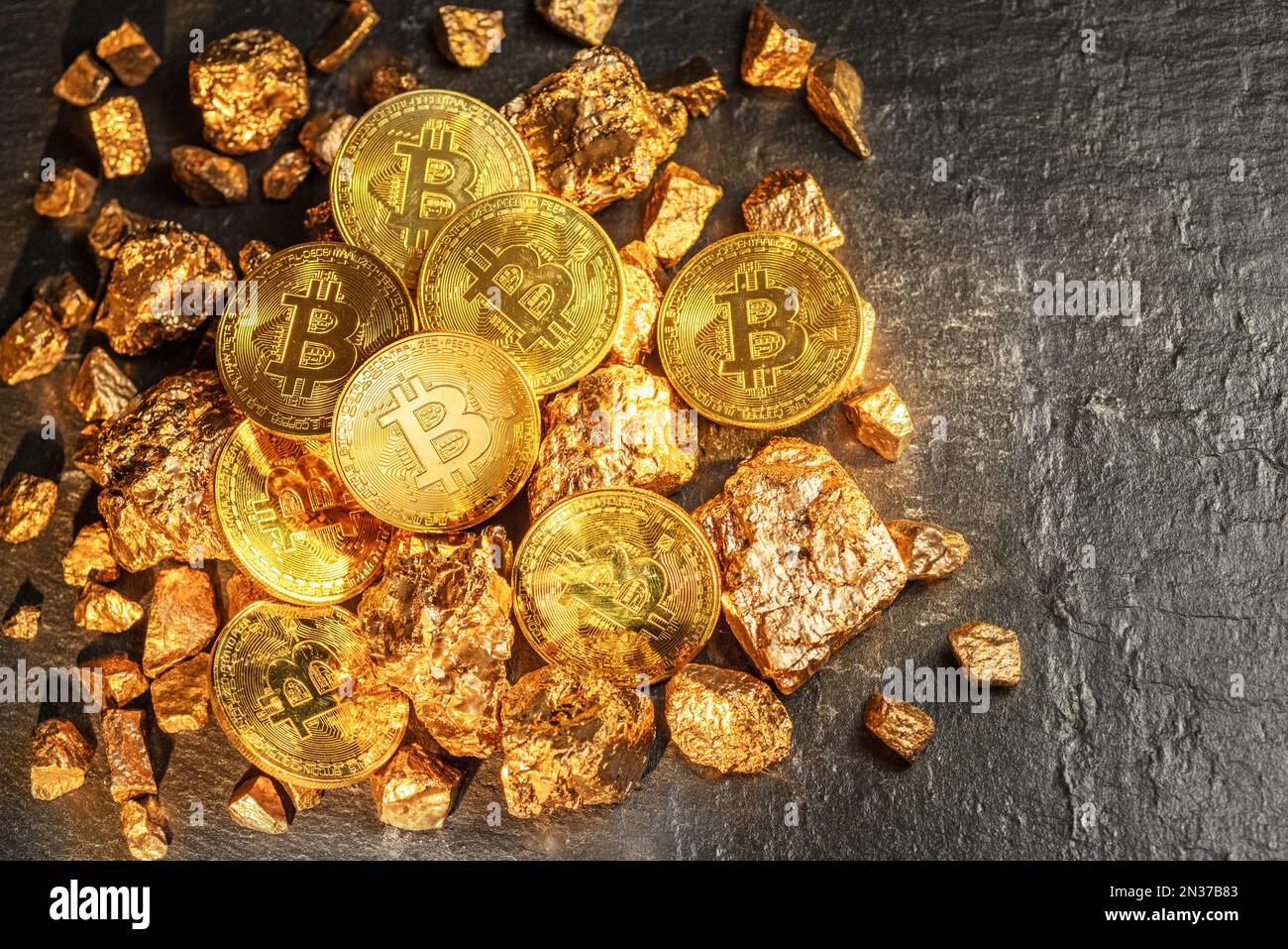 Bitcoins and pieces of gold closeup. Bitcoin against gold, what is the more  attractive asset Stock Photo - Alamy