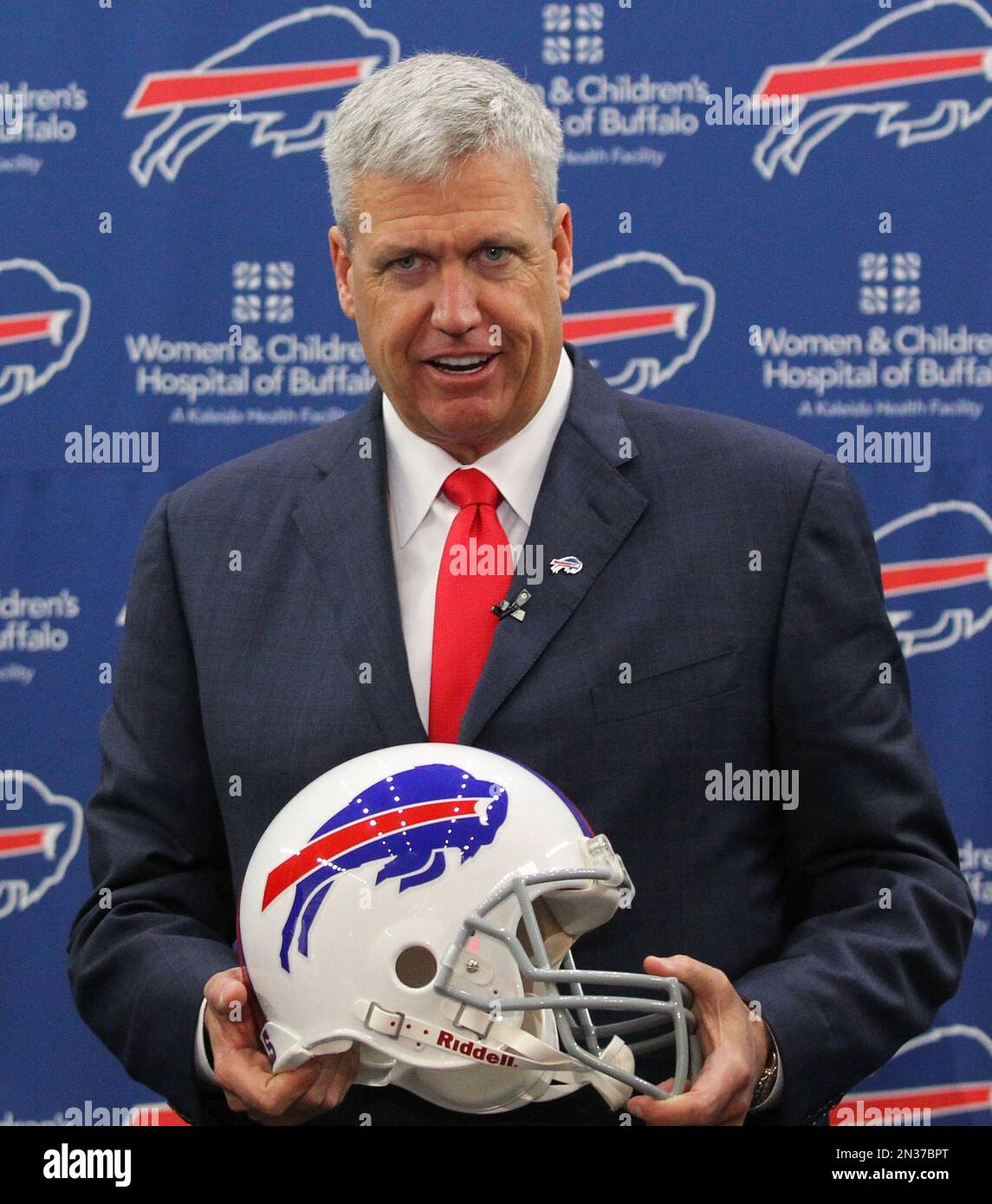 Rex Ryan poses for photos after an NFL football news conference where he was introduced as the