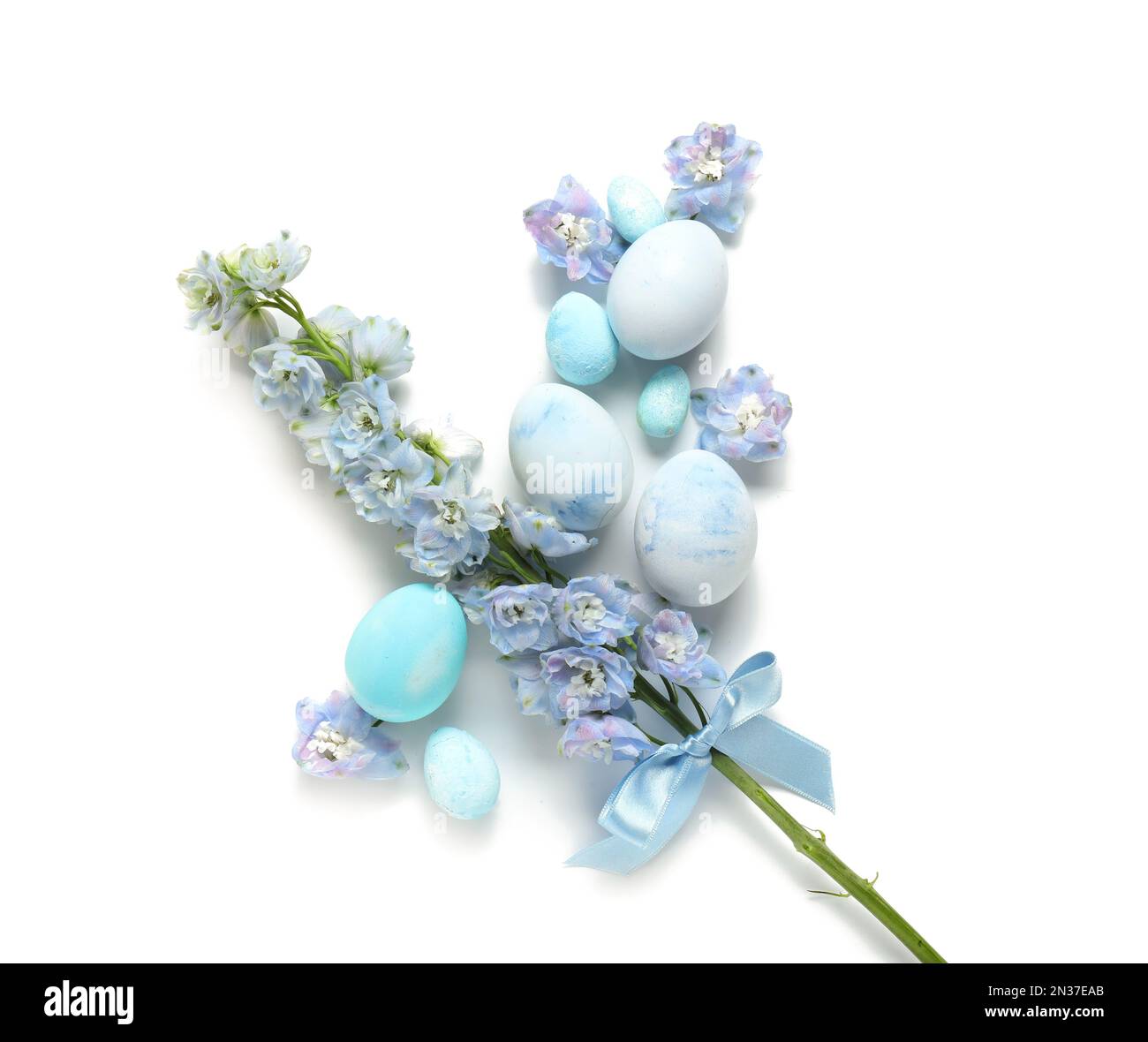 Composition with painted Easter eggs and beautiful flowers on white ...