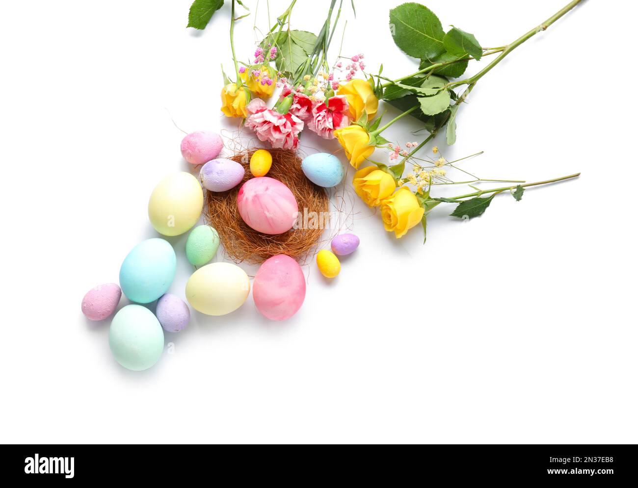 Composition with painted Easter eggs and flowers on white background ...