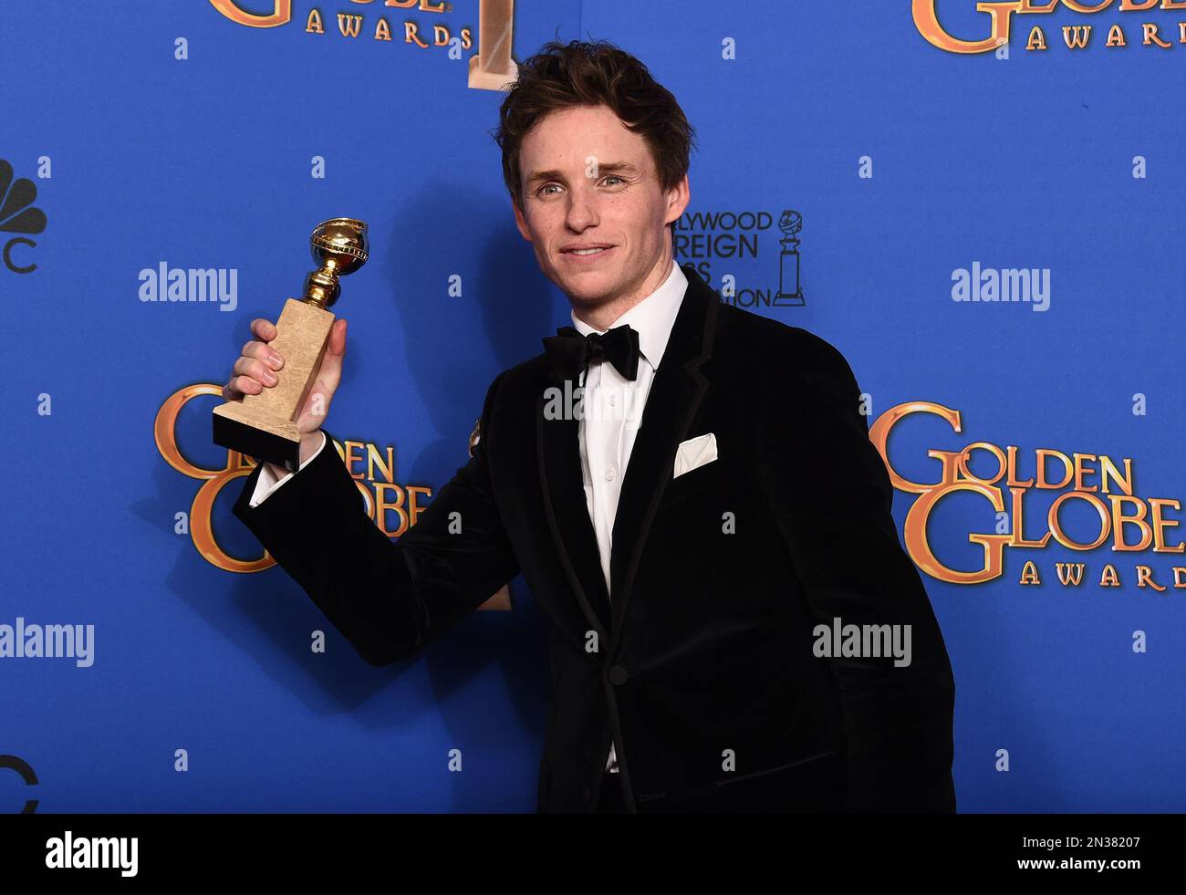 Eddie Redmayne poses in the press room with the award for best actor in ...