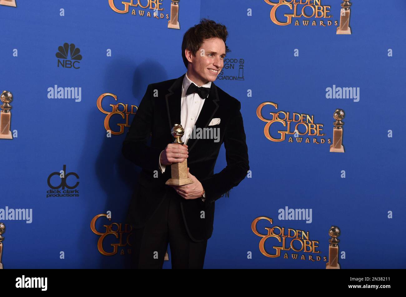Eddie Redmayne poses in the press room with the award for best actor in ...