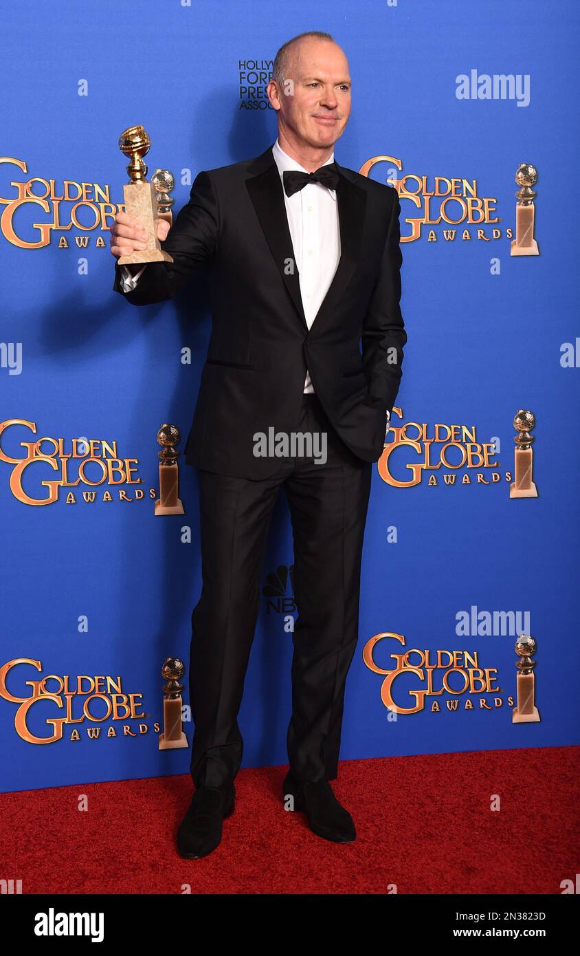 Michael Keaton poses in the press room with the award for best actor in