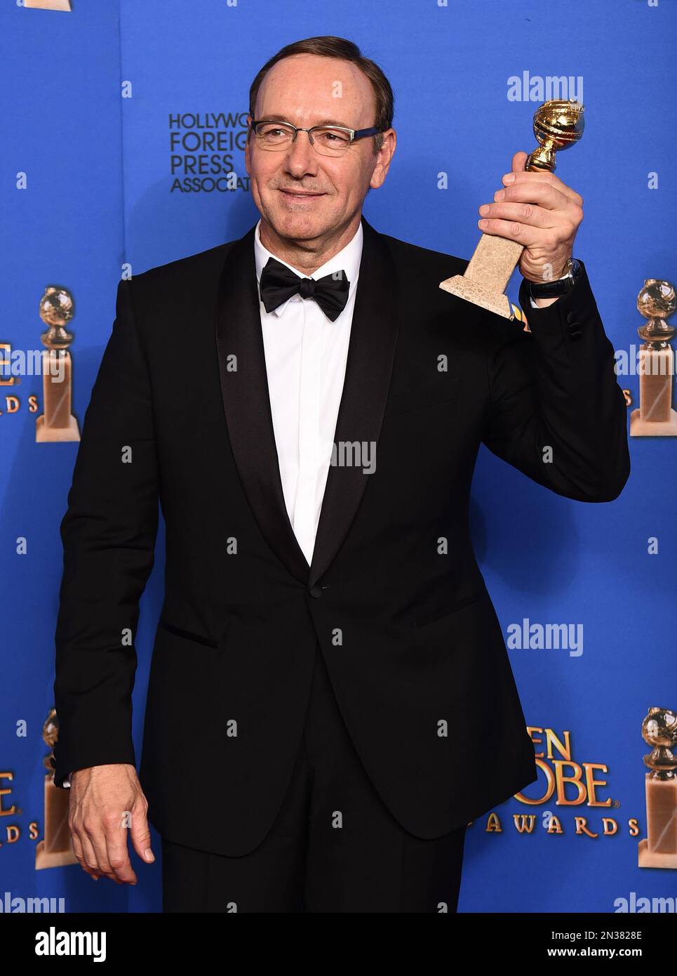 Kevin Spacey poses in the press room with the award for best actor in a