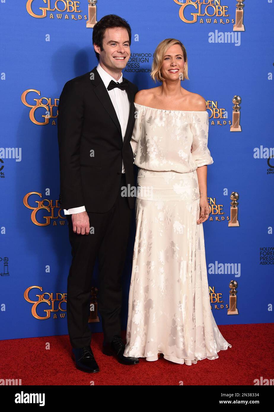 Bill Hader, left, and Kristen Wiig pose in the press room at the 72nd annual Golden Globe Awards