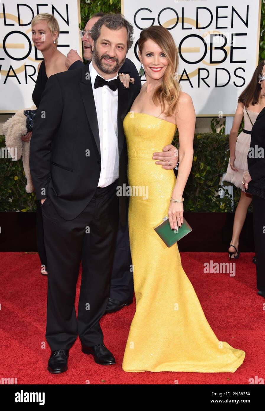 Judd Apatow, left, and Leslie Mann arrive at the 72nd annual Golden