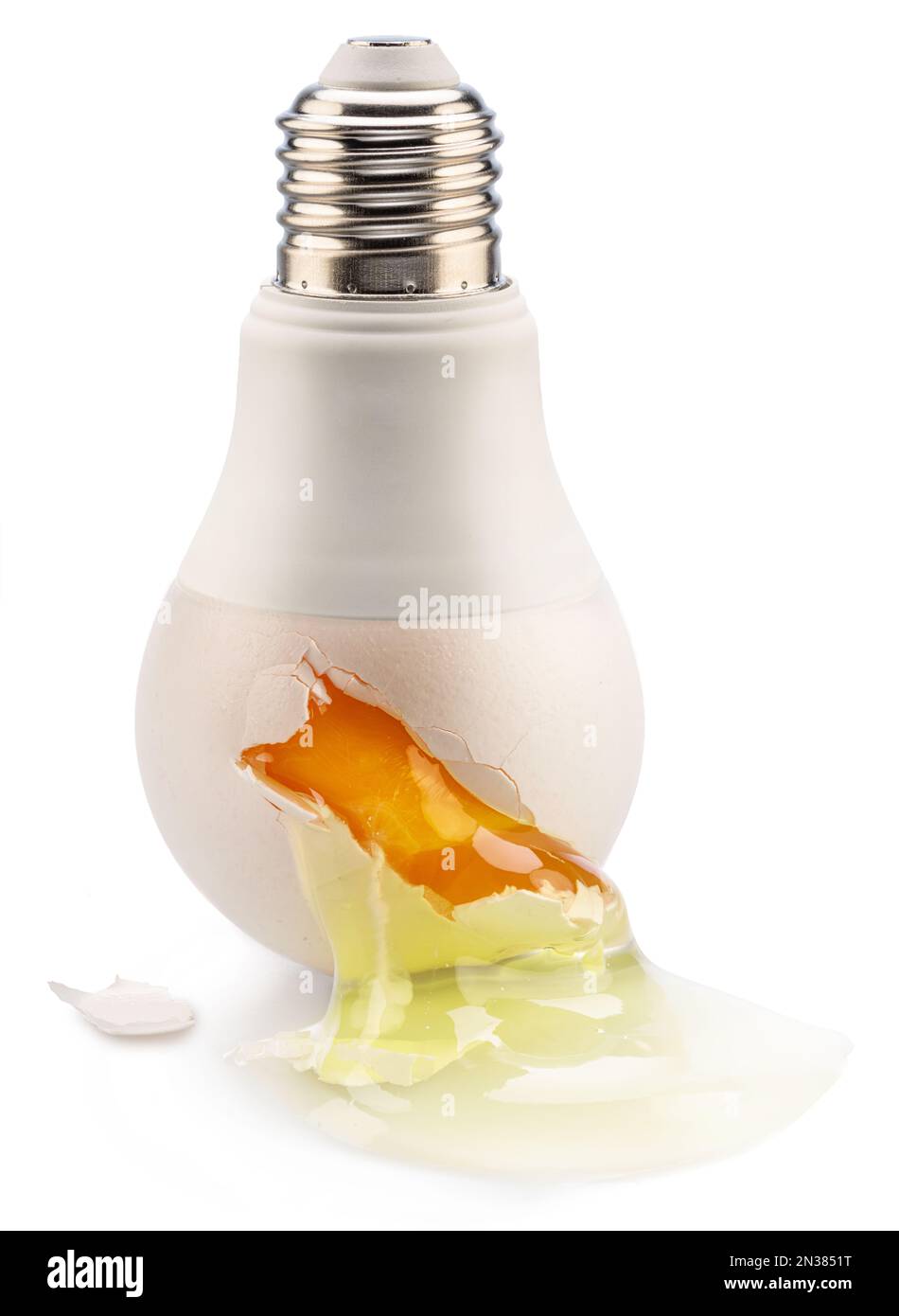 Egg yolk leaking from a light bulb crack - conceptual picture. Stock Photo