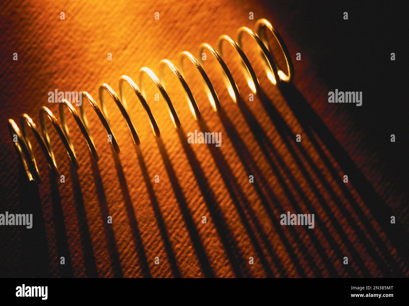Steel Spring and Shadow Stock Photo - Alamy