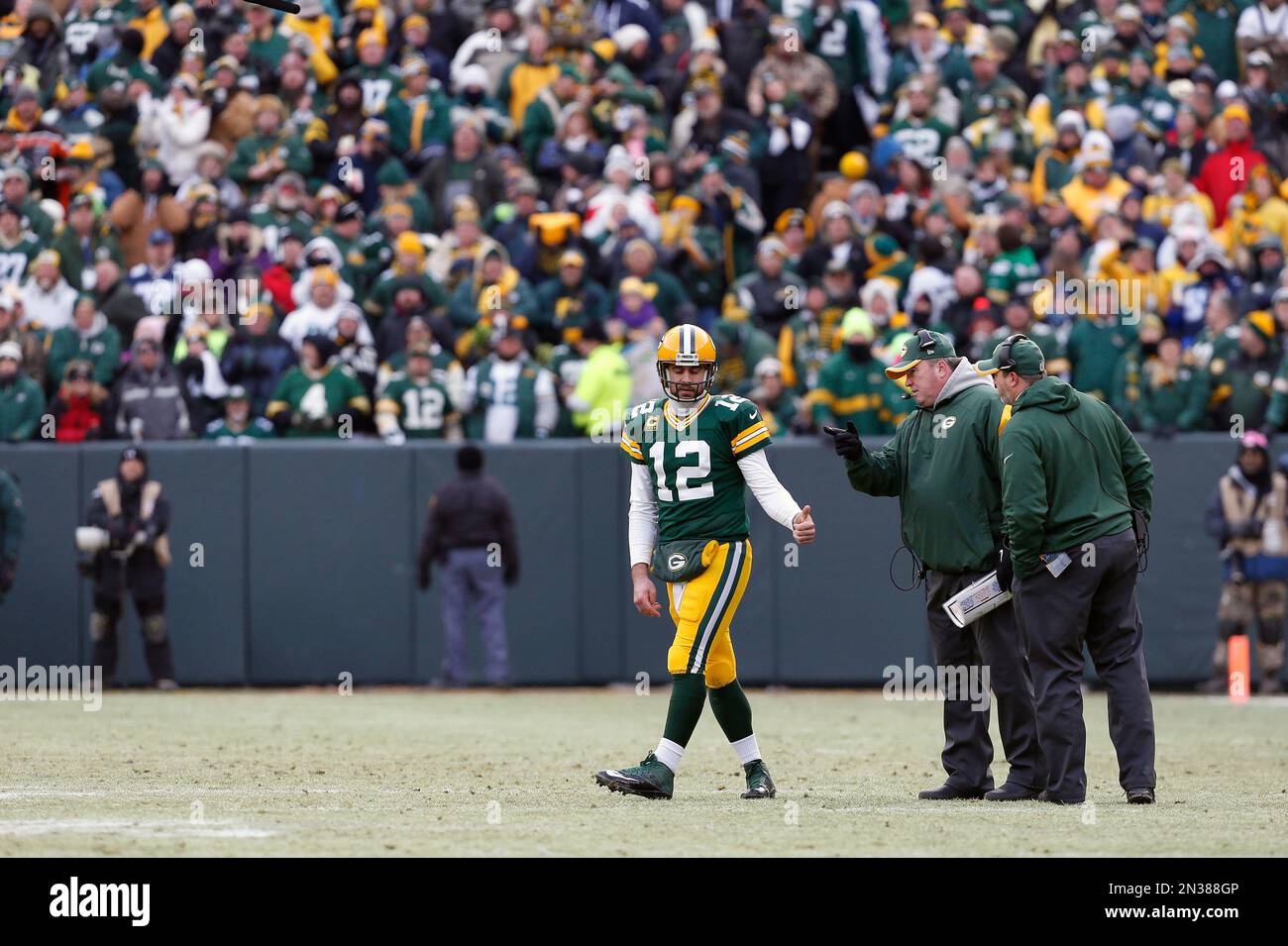 Green Bay Packers quarterback Aaron Rodgers (12) talks to head coach ...