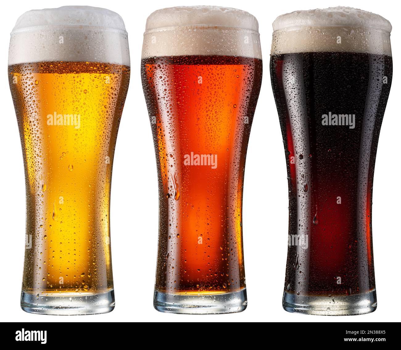 Three chilled glasses of different beer . File contains clipping paths
