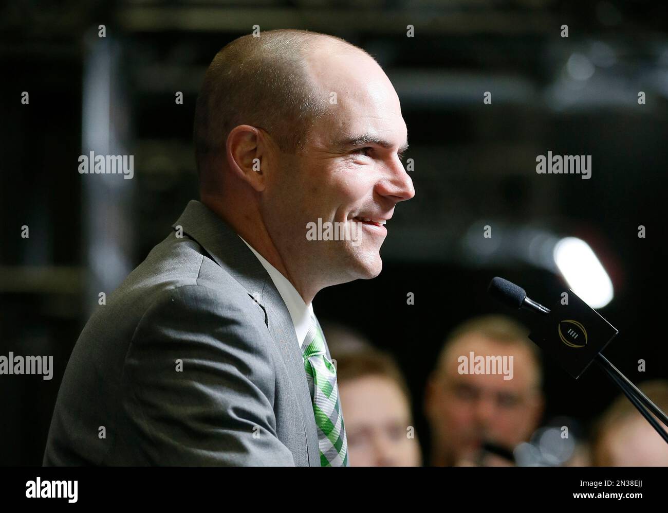 Oregon head coach Mark Helfrich responds to questions during media day