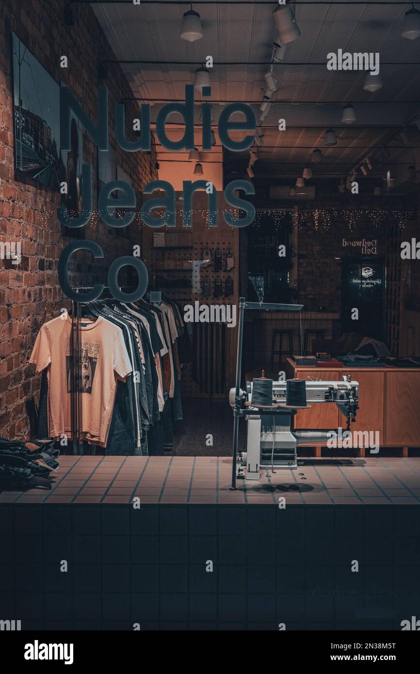 A vertical shot of the Nudie Jeans Co store at night in Ponsonby, Auckland, New  Zealand Stock Photo - Alamy