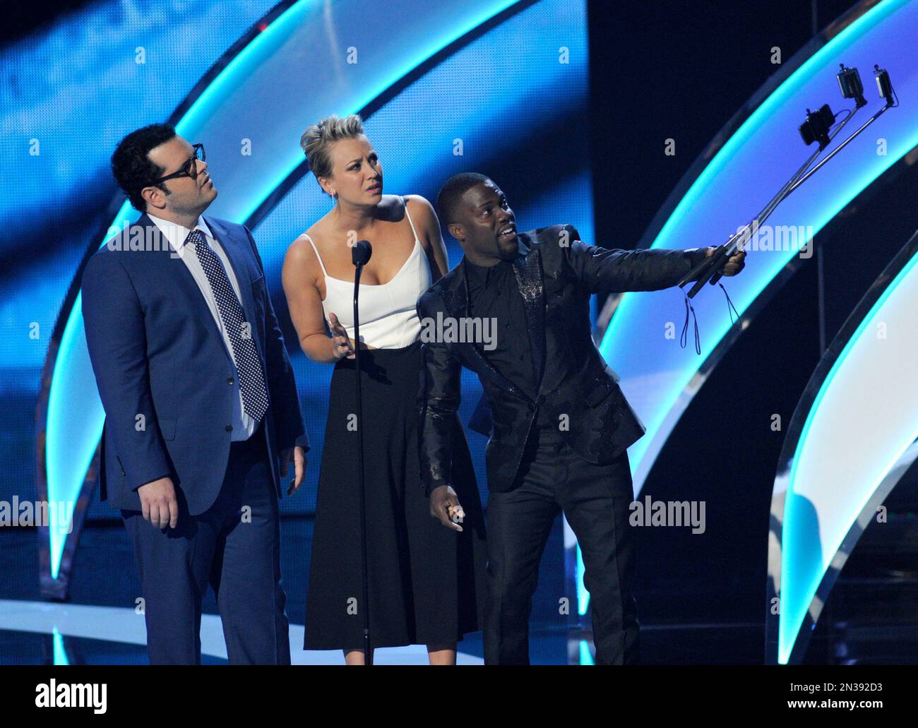 Josh Gad, from left, Kaley Cuoco and Kevin Hart present the award for