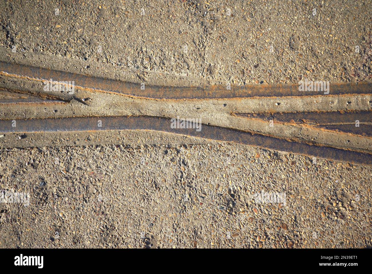 Old rusty railway track embedded in concrete Stock Photo Alamy