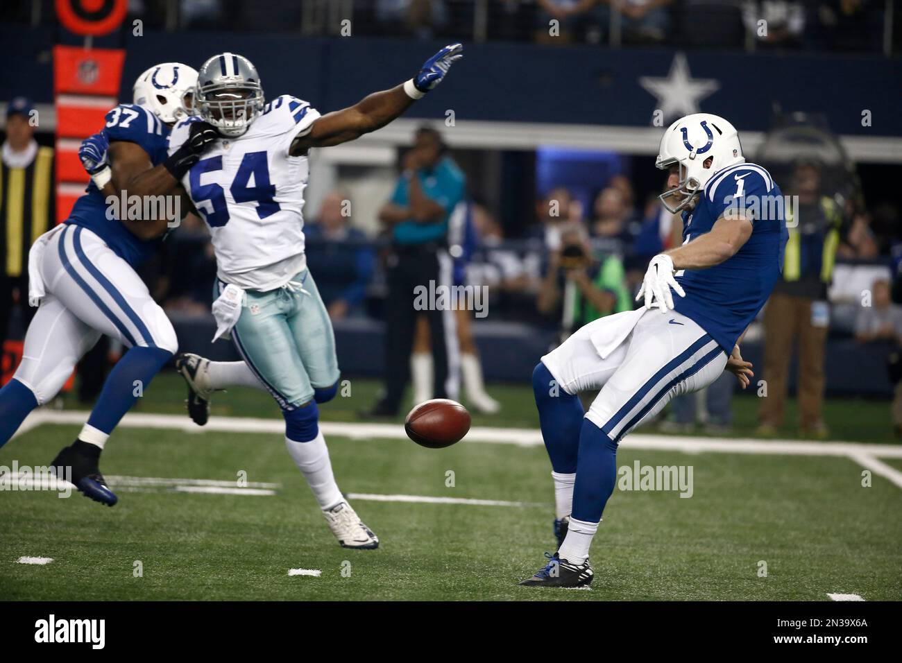 Indianapolis Colts punter Pat McAfee (1) punts the ball as running back ...