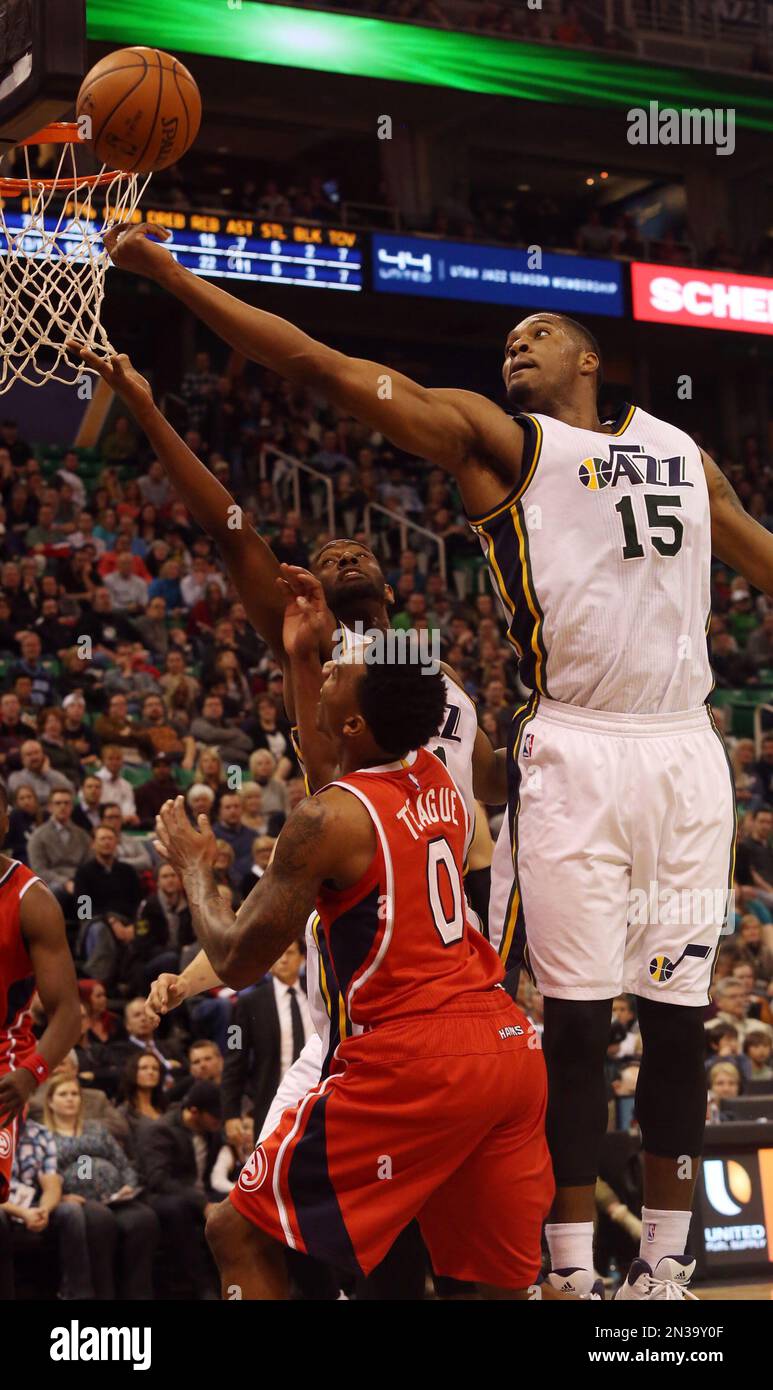 Utah Jazz's Ian Clark, back, and Derrick Favors (15) rebound the ball