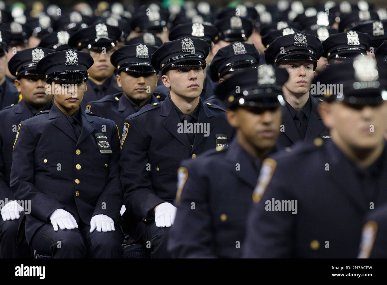 New recruits attend their New York Police Academy graduation ceremony ...