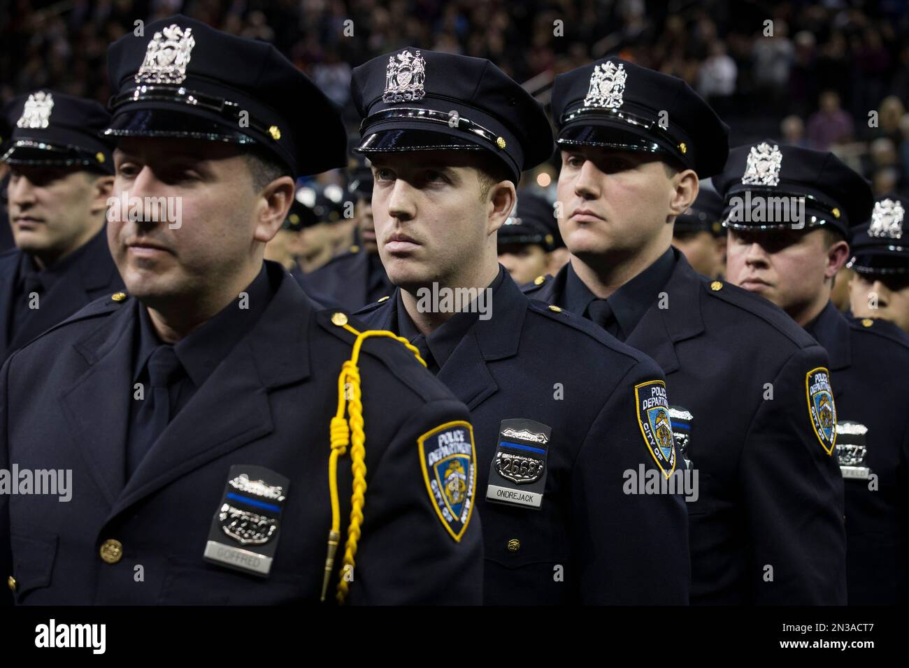 New recruits wear bands over their badges in honor of deceased officers ...