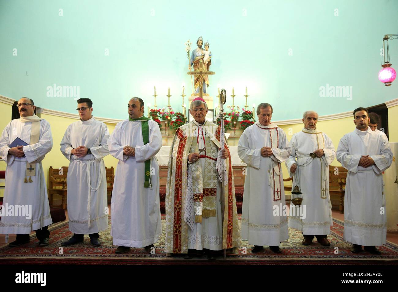 Assyrian Arch Bishop Ramzi Garmou, center, leads Mass that started on ...