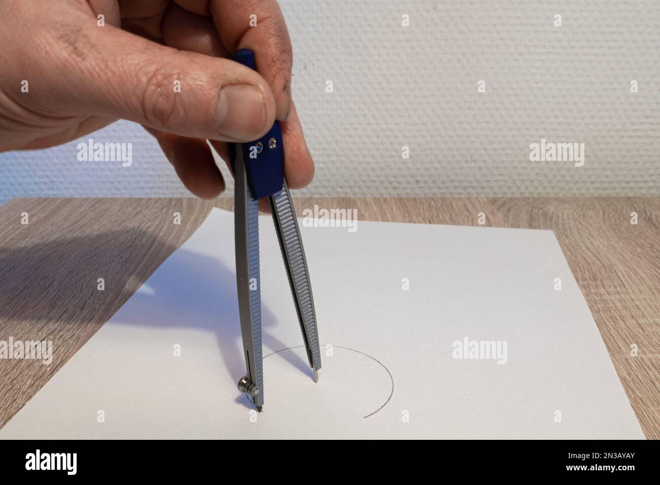 Making a circle with a drawing compass Stock Photo Alamy