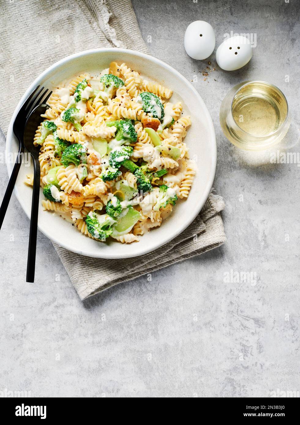 Rotini With Broccoli In A Cream Sauce And A Glass Of White Wine On A ...