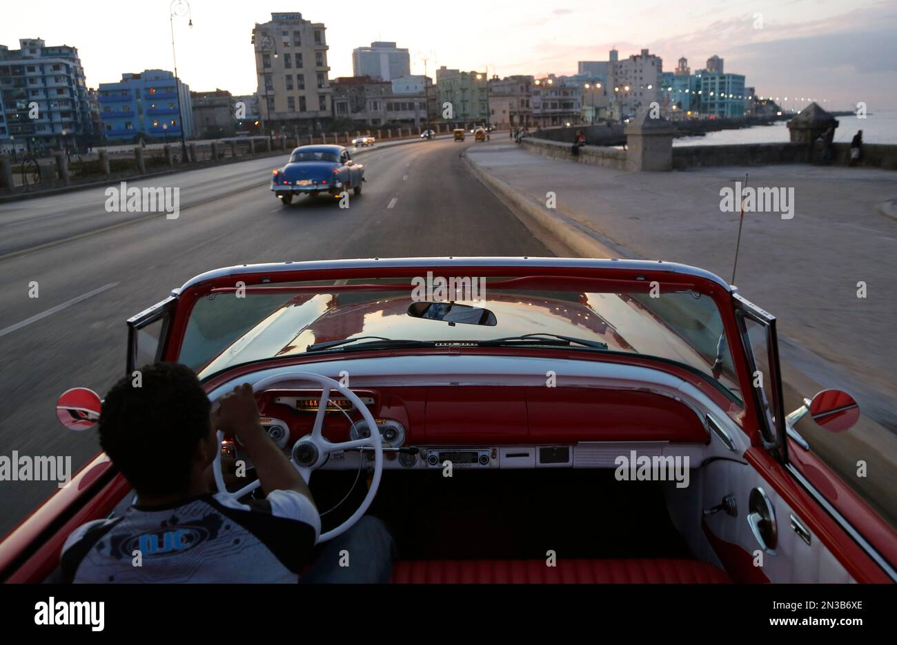 Michel Salgado drives his 1957 Mercury Monterrey convertible car along