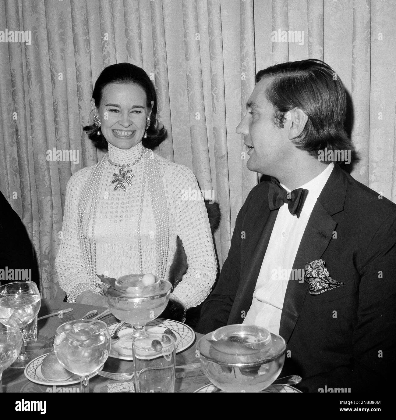 Gloria Vanderbilt and her husband Wyatt Cooper have dinner at the