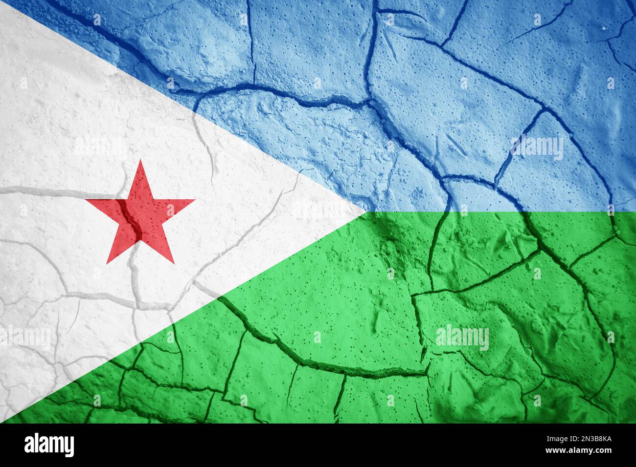 Flag of Djibouti. Djibouti symbol. Flag on the background of dry cracked earth. Djibouti flag with drought concept Stock Photo