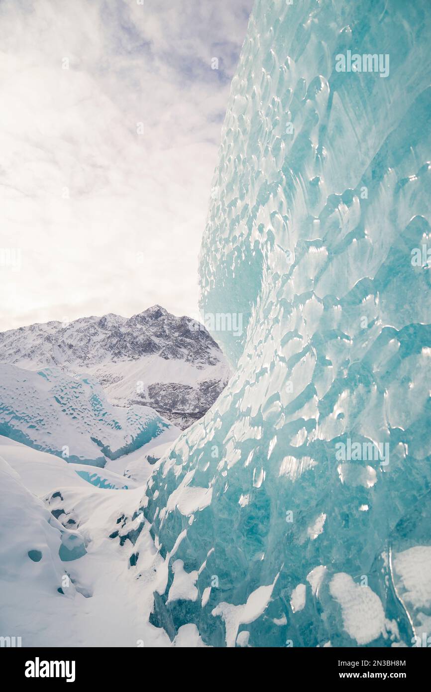 Pieces of blue ice tower above in the Alaskan winter at Knik Glacier, to the east of Palmer, Alaska and near Anchorage Stock Photo
