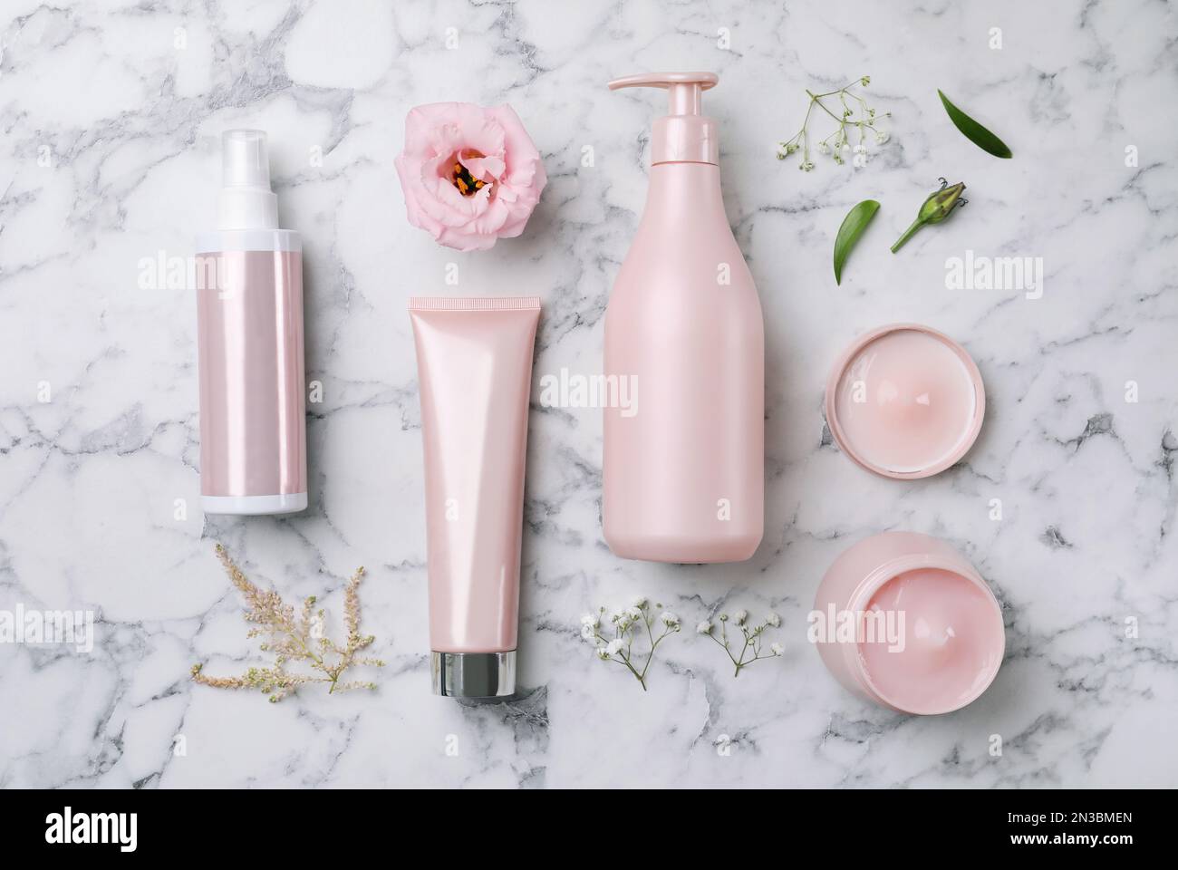 Flat lay composition with hair cosmetic products on white marble table ...