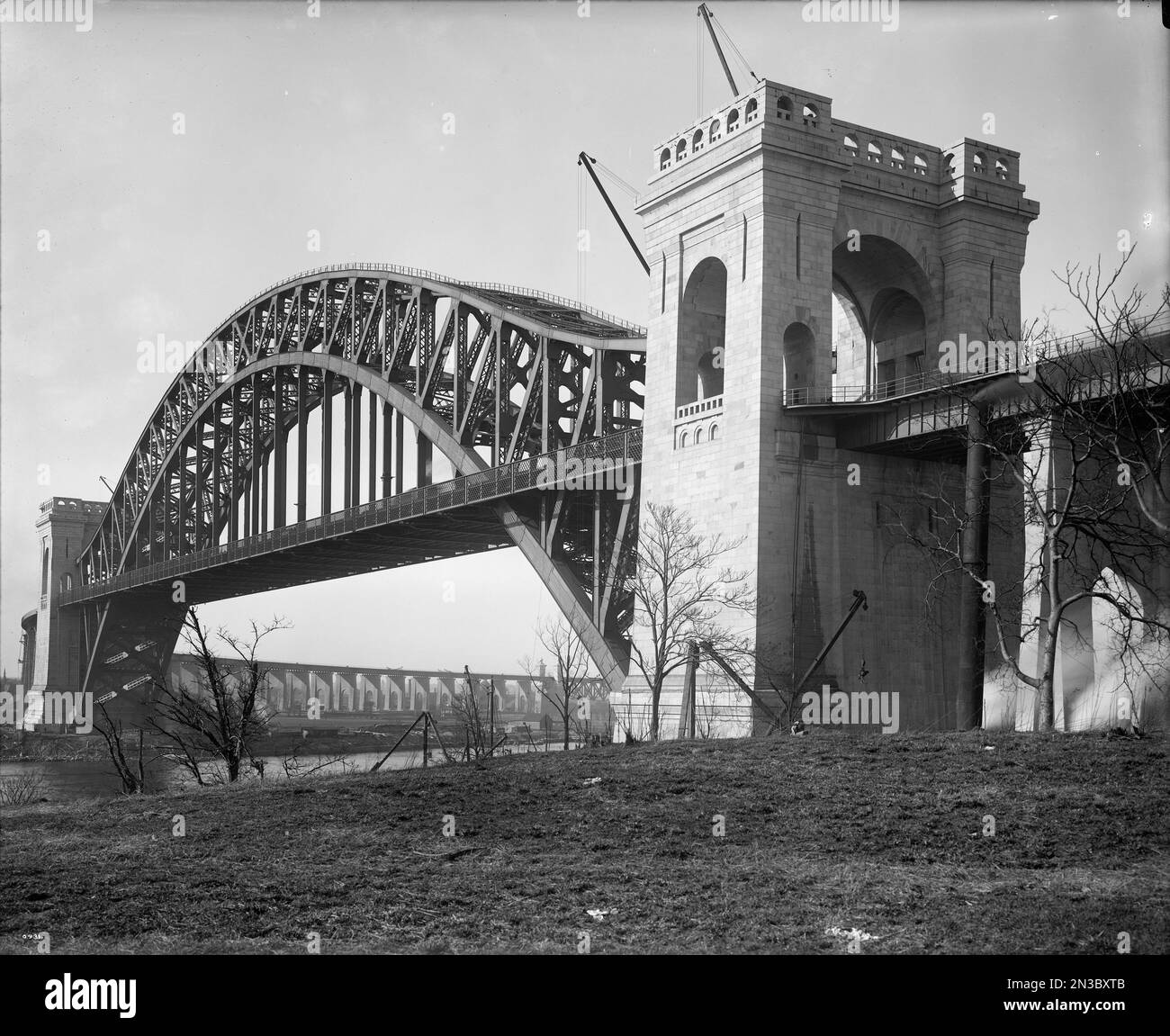 Historic view of The Hell Gate Bridge, originally the New York Connecting Railroad Bridge or the East River Arch Bridge, a steel through arch railroad bridge in New York City, America Stock Photo