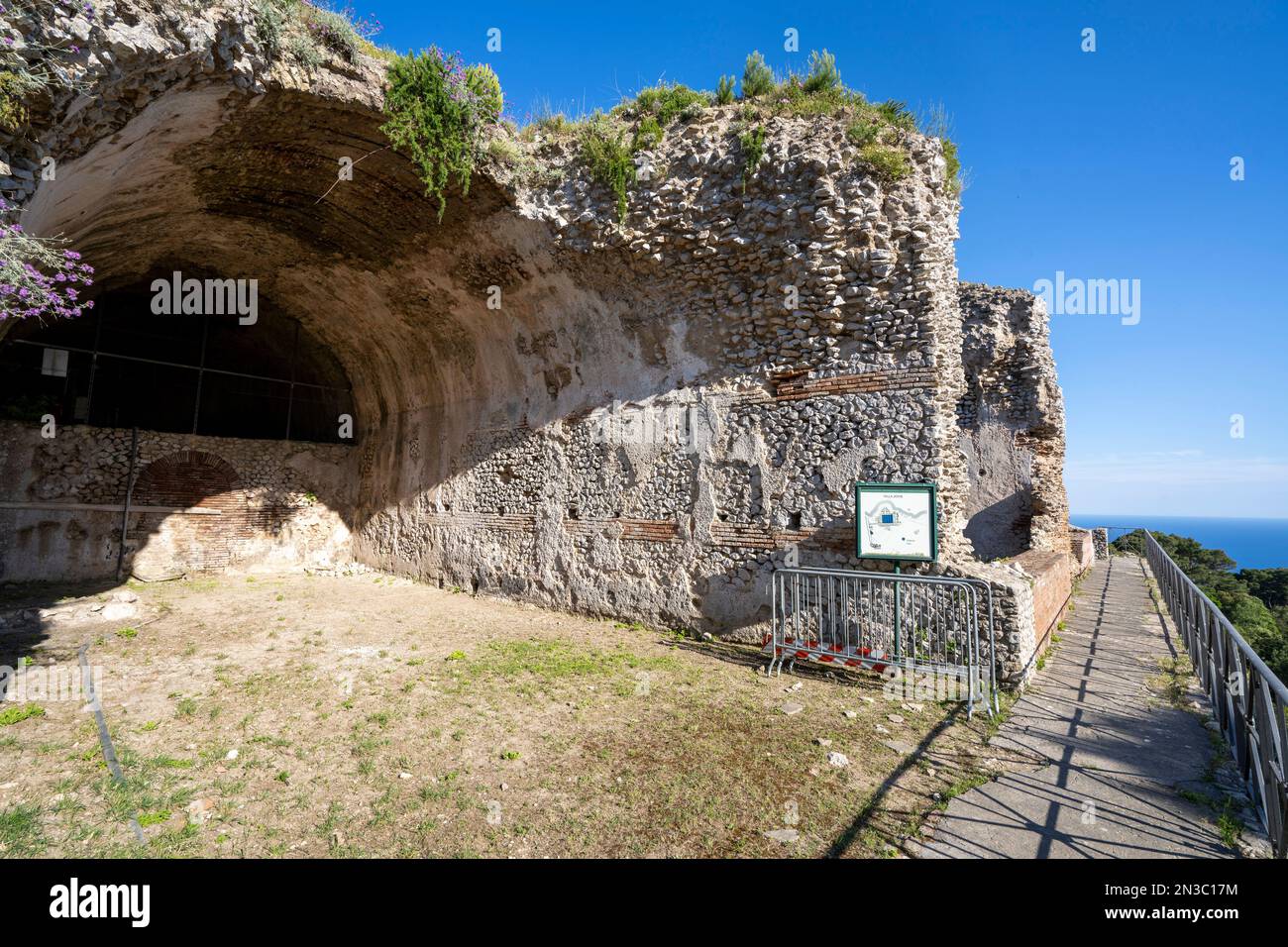 Walkway and the Grotta di Tiberio at Villa Jovis on the Island of Capri; Naples, Capri, Italy Stock Photo