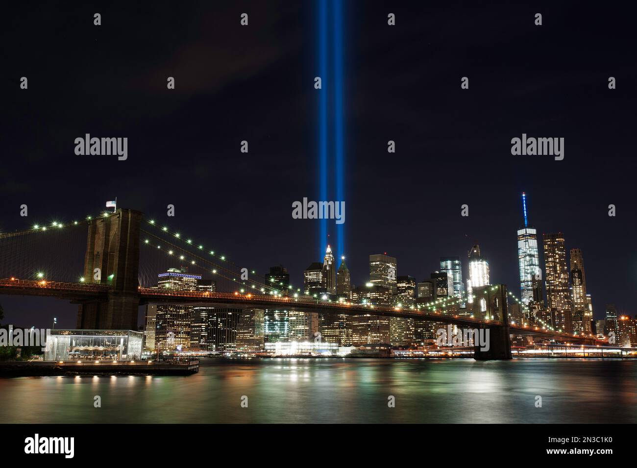 Every year on the 9/11 New York City celebrates he victims of the Twin Towers switching on two streams of blue lights. The tribute in light. Stock Photo