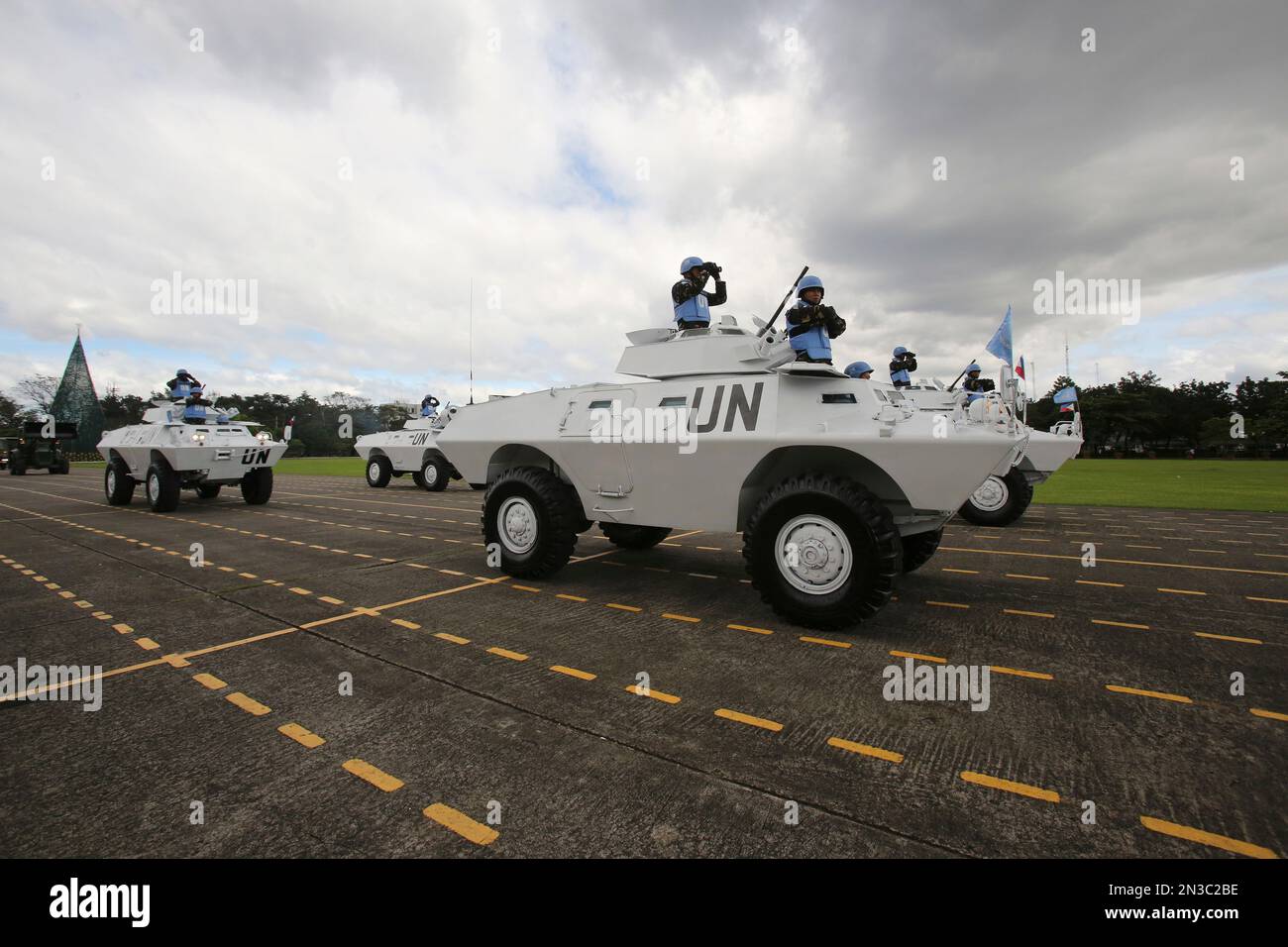 Philippine UN Peacekeepers ride on armored personnel carriers during ...