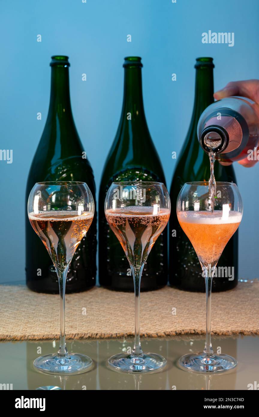 Tasting of rose brut Champagne sparkling wine in cellars of gran cru