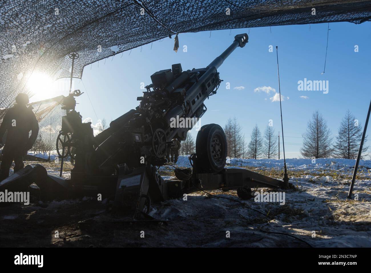 U.S. Marines with 3d Battalion, 12th Marines prepare a fire mission for the M777 towed 155 mm howitzer while conducting live-fire training during Artillery Relocation Training Program 22.4 at the Yausubetsu Maneuver Area, Hokkaido, Japan, Jan. 28, 2023. The skills developed at ARTP increase the proficiency and readiness of the only permanently forward-deployed artillery unit in the Marine Corps, enabling them to provide precision indirect fires. (U.S. Marine Corps photo by Lance Cpl. Jaylen Davis) Stock Photo