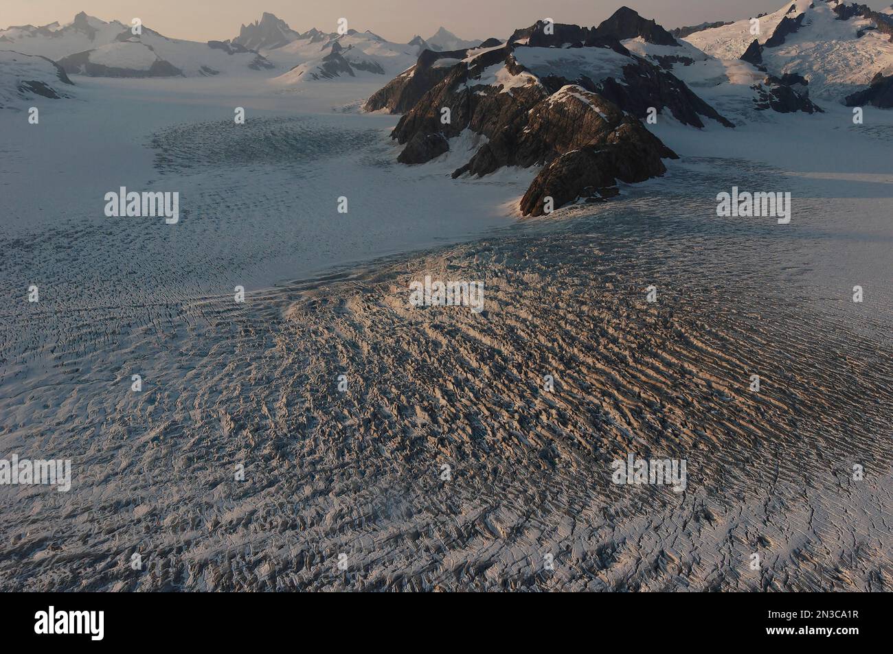 LeConte Glacier in the Stikine Icefield is marked by granite peak formations such as Devis Thumb in the background and is one of the few remnants o... Stock Photo