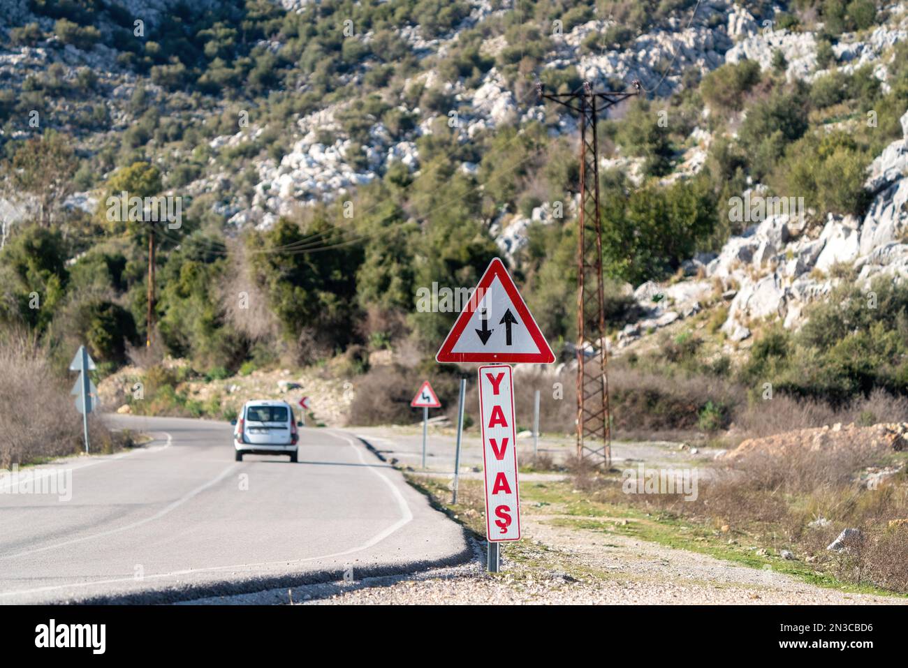Slow on curve warning and two-way traffic sign Stock Photo
