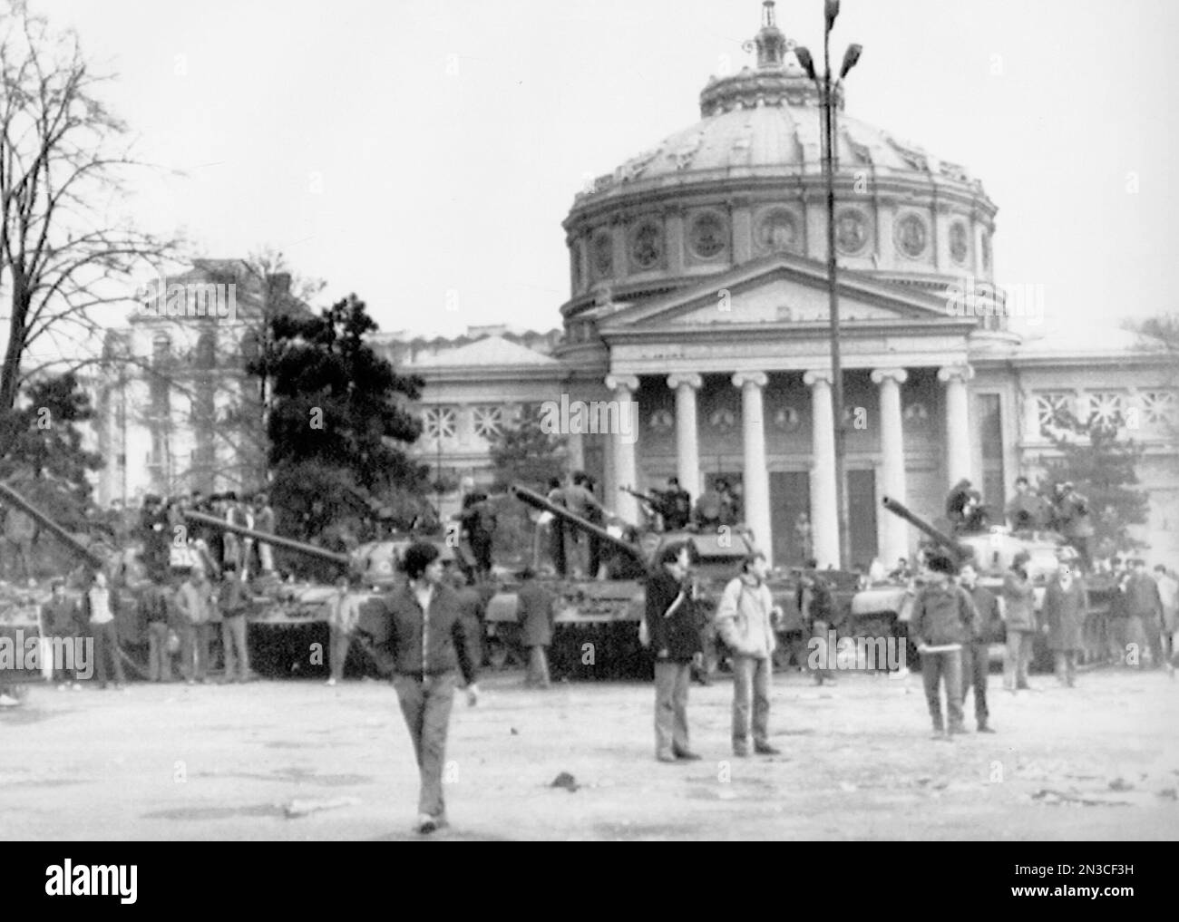 Tanks are parked outside the Artenaeum in Bucharest on December 24 ...